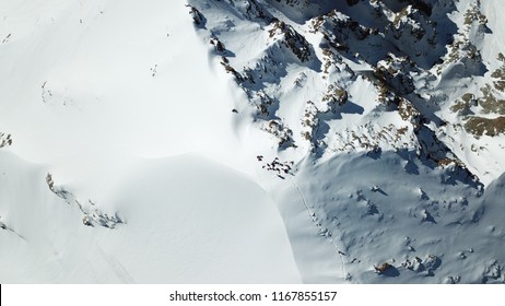 View of the snow top of the mountain from above. Group of climbers at the peak. - Powered by Shutterstock