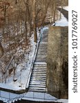 A view of the snowy steps in the winter forest,