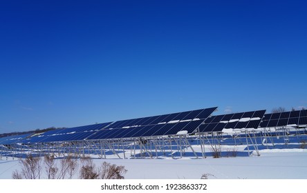 View Of Solar Panels Covered With Snow At A Solar Farm In Montgomery, New Jersey, United States, After A Snowfall.