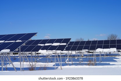 View Of Solar Panels Covered With Snow At A Solar Farm In Montgomery, New Jersey, United States, After A Snowfall.