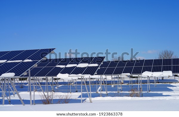 View of\
solar panels covered with snow at a solar farm in Montgomery, New\
Jersey, United States, after a\
snowfall.