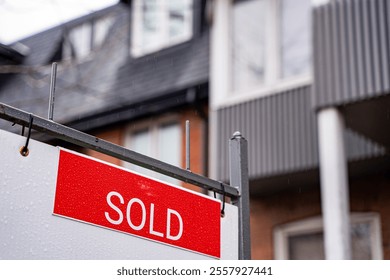 View of the Sold sign in front of the house.