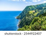 A view south of coastal scenery from the viewpoint at Sossego on the island of Sao Miguel in the Azores in summertime