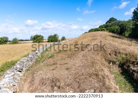 View of the Southern end of Belas Knap Long Barrow located along the Cotswold Way footpath on Cleeve Hill, Winchcombe, Cheltenham, UK, a Neolithic burial ground with false door from around 3000 BC