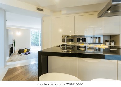 View of spacious kitchen in modern apartment - Shutterstock ID 238445662