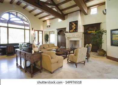 View of spacious living room with beamed ceiling at home