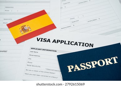 View of Spain visa application form with passport and national flag.