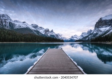 View of Spirit Island with wooden pier and Canadian Rockies on Maligne lake at Jasper national park, Canada