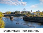 View of the Spokane River near the dam and alongside the pavilion at Riverfront Park at Autumn in downtown Spokane, Washington, USA.