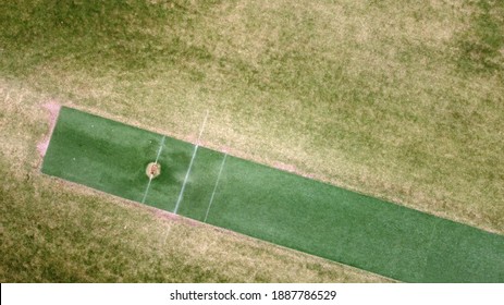 View of sports field including cricket and football using a drone