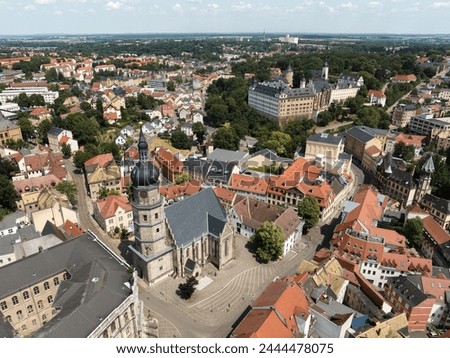 View from the St. Bartholomew Church in Altenburg towards the Altenburg residential castle. Aerial view of the city in Thuringia. Shot in summer.
