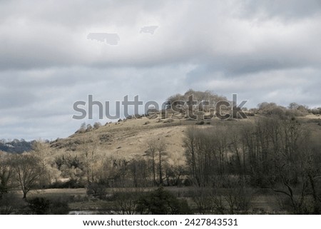 view of St Catherine's Hill Winchester Hampshire England on a winter day with cloudy sky in the background