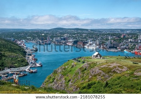 A view of St. John's harbour in Newfoundland, taken from atop Signal Hill, with the Queen's Battery in the foreground.
