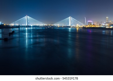 A View Of The St. Louis Skyline At Night Over The Mississippi River.