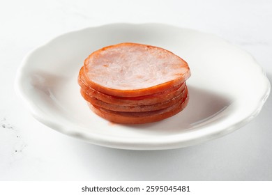 A view of a stack of Canadian bacon.