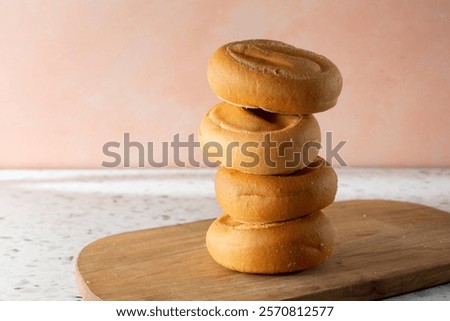 A view of a stack of plain gluten-free bagels.