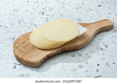 A view of a stack of provolone cheese.