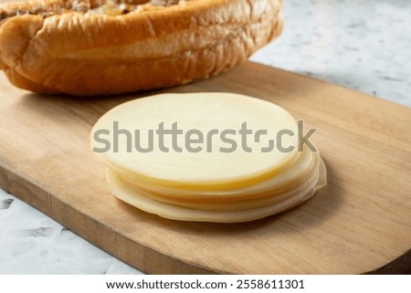 A view of a stack of provolone cheese.