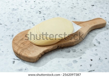 A view of a stack of provolone cheese.