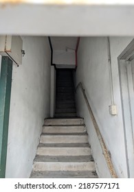 A view of a staircase going up with a dark and creepy situation.