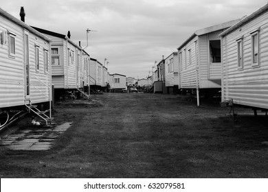 A View Of Static Mobile Holiday Homes With A Strip Of Grass Going Threw The Middle