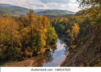 View From Steep Bank Of Afips River At Sunset. Scenic Sunny Golden Autumn Landscape Of Caucasus Mountain Forest At Seversky District, Krasnodar Region, West Caucasus, Russia