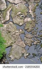 View Of Still Waters Of River With Rocks Seen From Above 