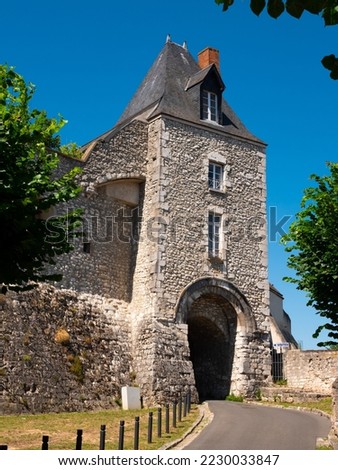 View of stone fortified tower with entrance gate to medieval Chateau royal de Montargis on hilltop on sunny summer day, Loiret department, France