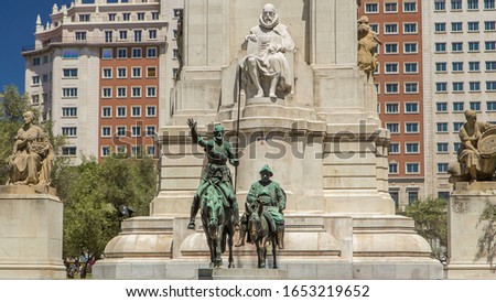 View of the stone sculpture of Miguel de Cervantes timelapse and bronze sculptures of Don Quixote and Sancho Panza on the Square of Spain (Plaza de Espana). 