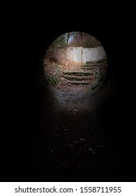 View Of Stone Steps Through A Culvert Tunnel