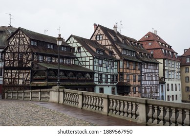 View Of Stoned Bridge And Medieval Buildings On The Channel At Little France Quarter In Strasbourg By Winter