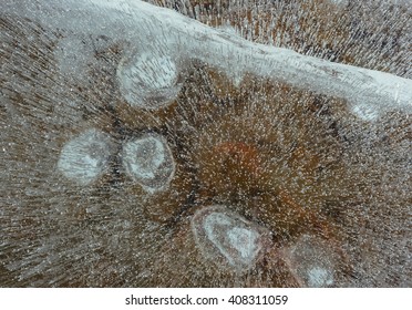 View of the stones through the beautiful and transparent ice. Unique, wonderful, clean, cool ice of the largest and cleanest lake in the world. - Powered by Shutterstock