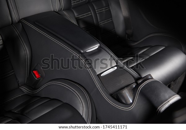 View of\
a storage compartment of a luxury car\
interior