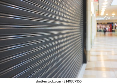View of stores show case in shopping mall closed due to sanctions and embargo, mass market cloth shops work stoppage with closed storefronts, retail business suspension and brands leaving market - Shutterstock ID 2140889355