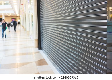 View of stores show case in shopping mall closed due to sanctions and embargo, mass market cloth shops work stoppage with closed storefronts, retail business suspension and brands leaving market - Shutterstock ID 2140889365
