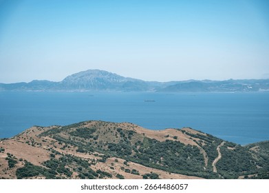 View of the Strait of Gibraltar separating Spain and Morocco, with cargo ships sailing