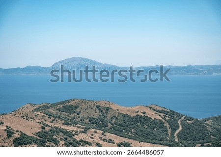 View of the Strait of Gibraltar separating Spain and Morocco, with cargo ships sailing