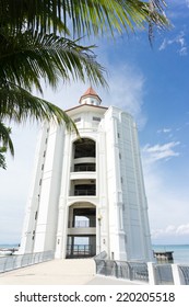 View Of Straits Quay Lighthouse In Penang, Malaysia Against Blue Sky