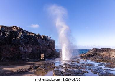 View at a stream of water and steam exploding from Nakalee blowhole, Maui, Hawaii