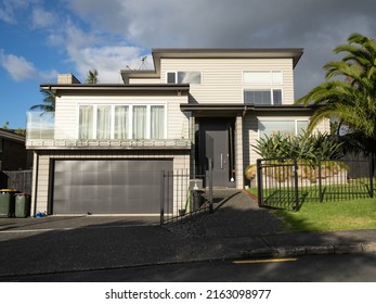 View of suburban house with garage. Auckland, New Zealand - May 20, 2022