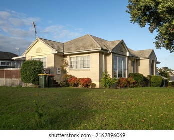 View of suburban house with white brick walls. Auckland, New Zealand - May 20, 2022