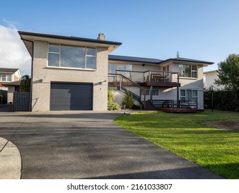 View Of Suburban Painted Brick House. Auckland, New Zealand - May 23, 2022