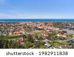 a view of the suburbs in denmark with blue sky