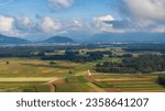 View of summer fields under clouds