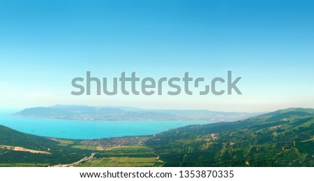View from the summer green mountains to the Black Sea coast, bay, panoramic view. Rossia, Tsemesskaya Bay, Novorossiysk, Kabardinka