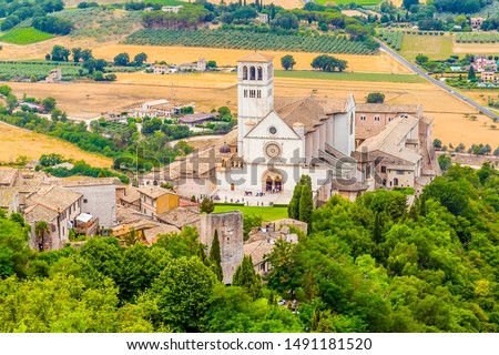 A view from the summit of Mount Subasio towards the Basilica of St Francis in Assisi, Umbria in summertime