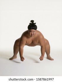 View Of A Sumo Wrestler Squatting