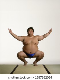 View Of A Sumo Wrestler Squatting