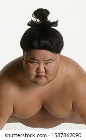 View Of A Sumo Wrestler Squatting