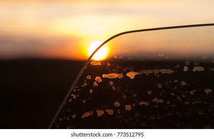 View Of The Sundown Through A Slightly Open Car Window